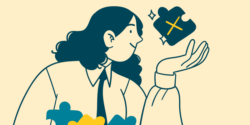woman holding a puzzle piece with an X through it and smiling.
